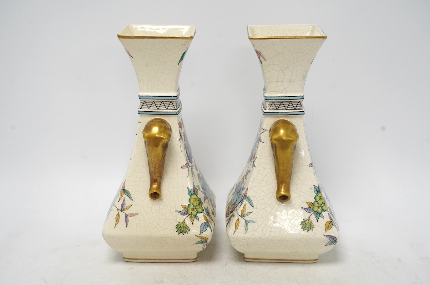 A pair of Christopher Dresser Old Hall crackleware Japanese inspired vases with gilt decorated elephant handles, 24cm high. Condition - good